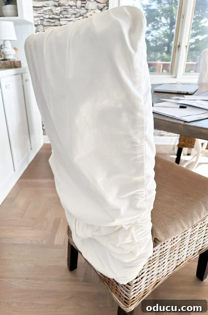 The Style Icon Who Solved My Decorating Dilemma 2 worn and stretched out dining chair back slipcover
