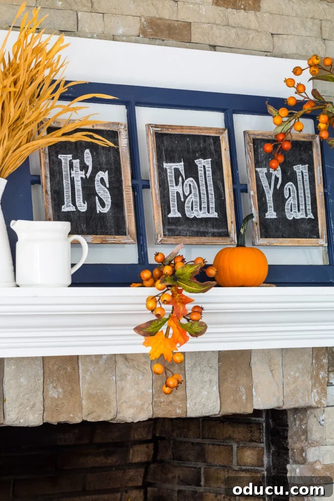 Effortless Autumn Pumpkin Decorating 8 A charming fall mantel decorated with repurposed items, featuring a small pumpkin perfectly integrated into an 'It's Fall Y'all' theme.