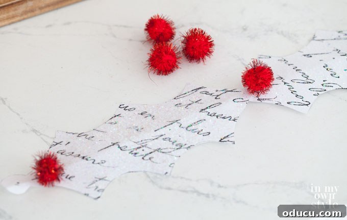 DIY Holly Leaf Christmas Garland 19 Pom-pom crafts for the holidays: Adding colorful berries to paper garlands