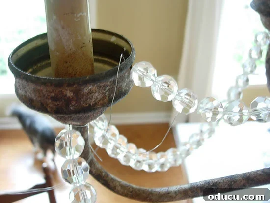 dining-room-chandy-wire-in- Securing florist wire to chandelier