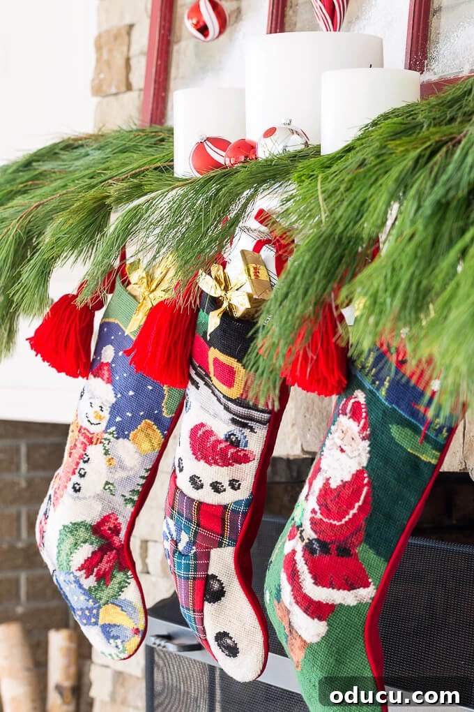Beyond the Mantel: Clever Ways to Hang Christmas Stockings 2 Festive Christmas decor with frosted window panes and greenery, offering alternative ideas for hanging stockings.