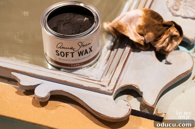 The Annie Sloan Secret to a Stunning Mirror Makeover 7 How to apply dark wax over chalk paint, illustrating the technique for an aged finish.
