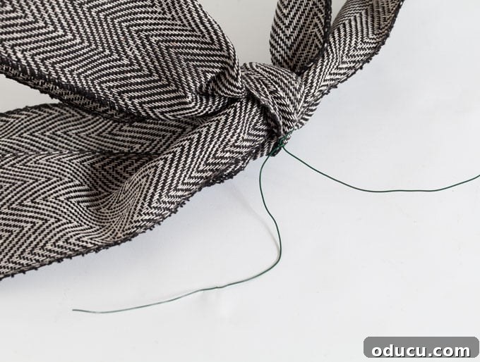 Mastering Ribbon Bows: Simple Steps for Gifts, Wreaths, and Decor 19 Attaching-wire-to-a-bow-so-you-can-hang-it