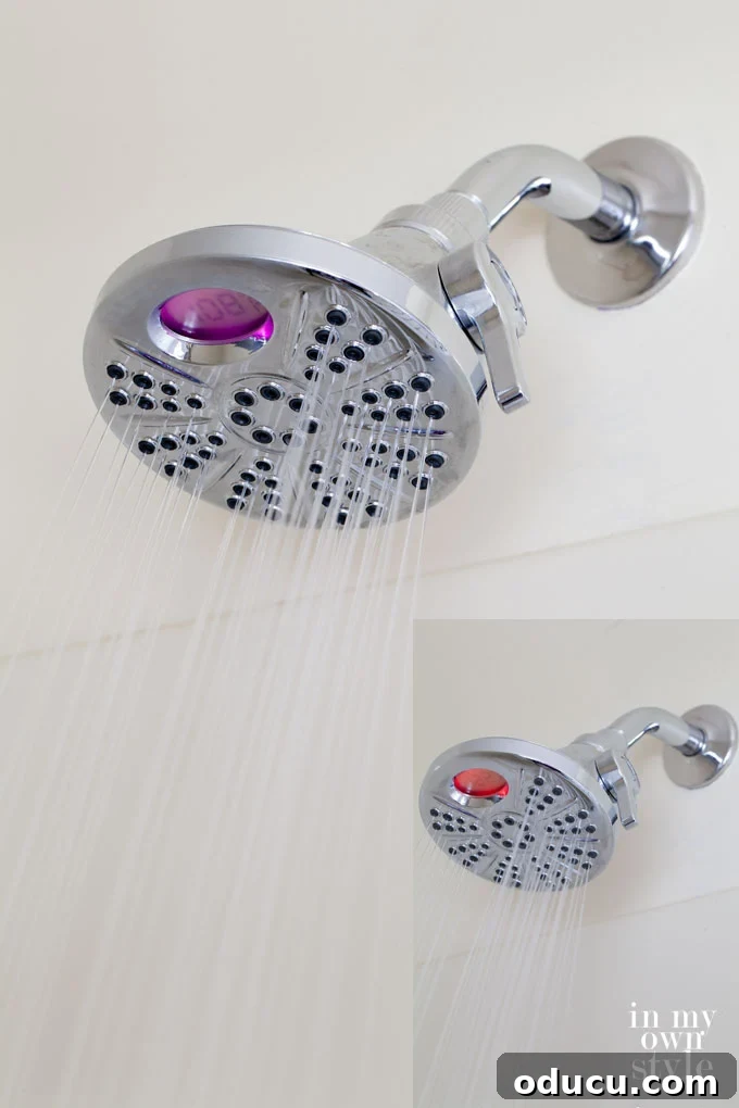 Your Welcome Space Awaits 7 Delta-Temp-2-O-Showerhead-for-bathrooms - A modern showerhead with a digital temperature display