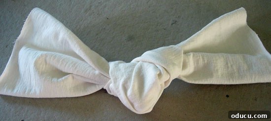 Slipcover-How-to-back-knot How to make a chair back slipcover. The beautifully tied knot, ready to be integrated into the slipcover design.