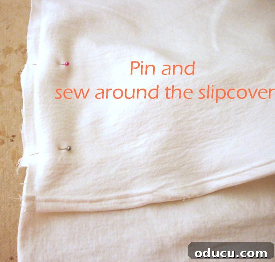 Transform Your Dining Chairs with Easy DIY Slipcovers 10 Pictured instructions on how to make dining room chair back covers. Detailed visual guide for layering and pinning all slipcover components before the final stitch.