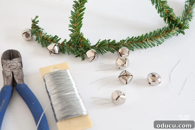 DIY Christmas Gift Jars: A Festive Alternative to Bags 6 Festive Mason jar gift ideas: close-up of jingle bells being attached to the garland tie handle.