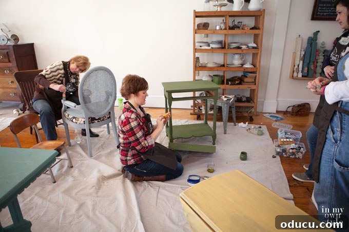 Transform Your Furniture with Miss Mustard Seed Milk Paint 6 Workshop participants learning the controlled chipping technique with beeswax and milk paint