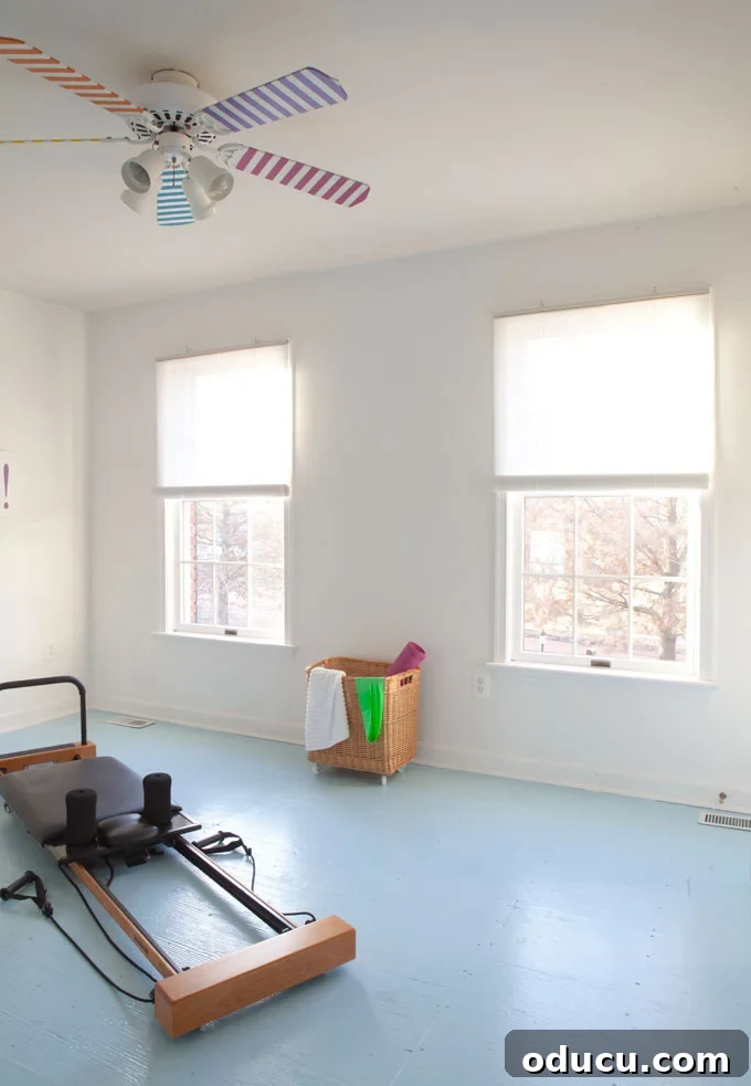 Fitness Room Transformation 15 Affordable-Window-Blinds on two windows in a bedroom turned into a fitness room