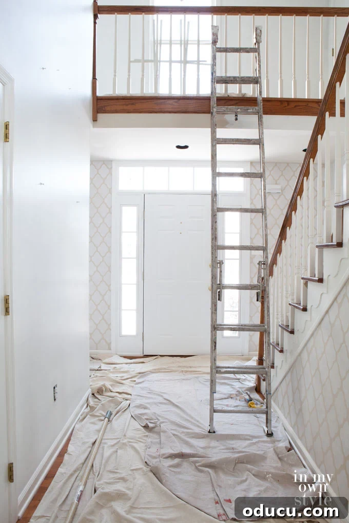 The Luminous Threshold: A Grand New Welcome 3 Painting a Two-Story Foyer