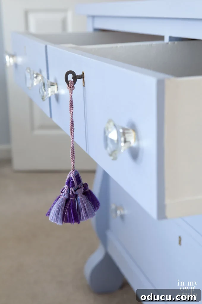 Modern chalk painted dresser with no distressing, showcasing a smooth, contemporary finish. Includes tips on painting metal details to look like brass.