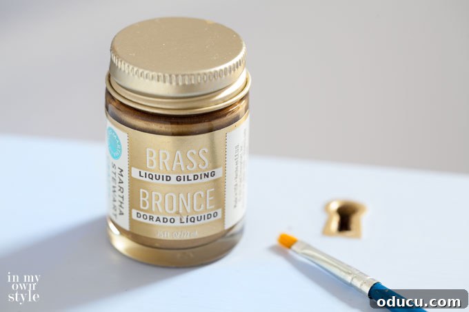 Detailed close-up on how to paint furniture metal parts with brass paint.