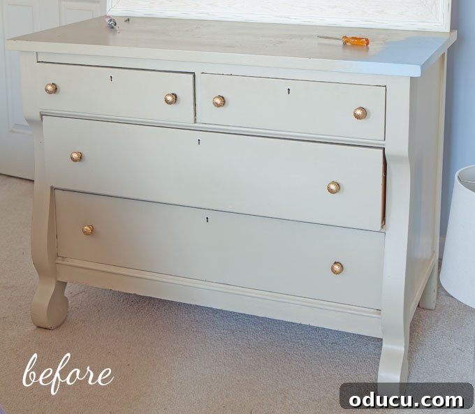 Pale green dresser before its modern chalk paint makeover