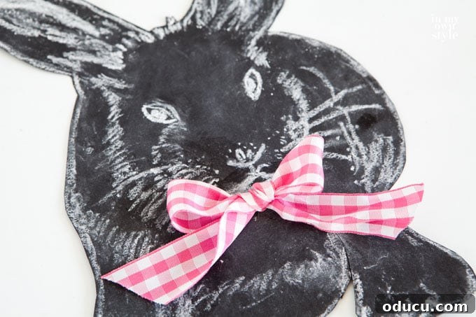 Elevate Your Easter Decor with 3D Chalk Art 12 3D Chalkboard bunny sketch with a ribbon bow