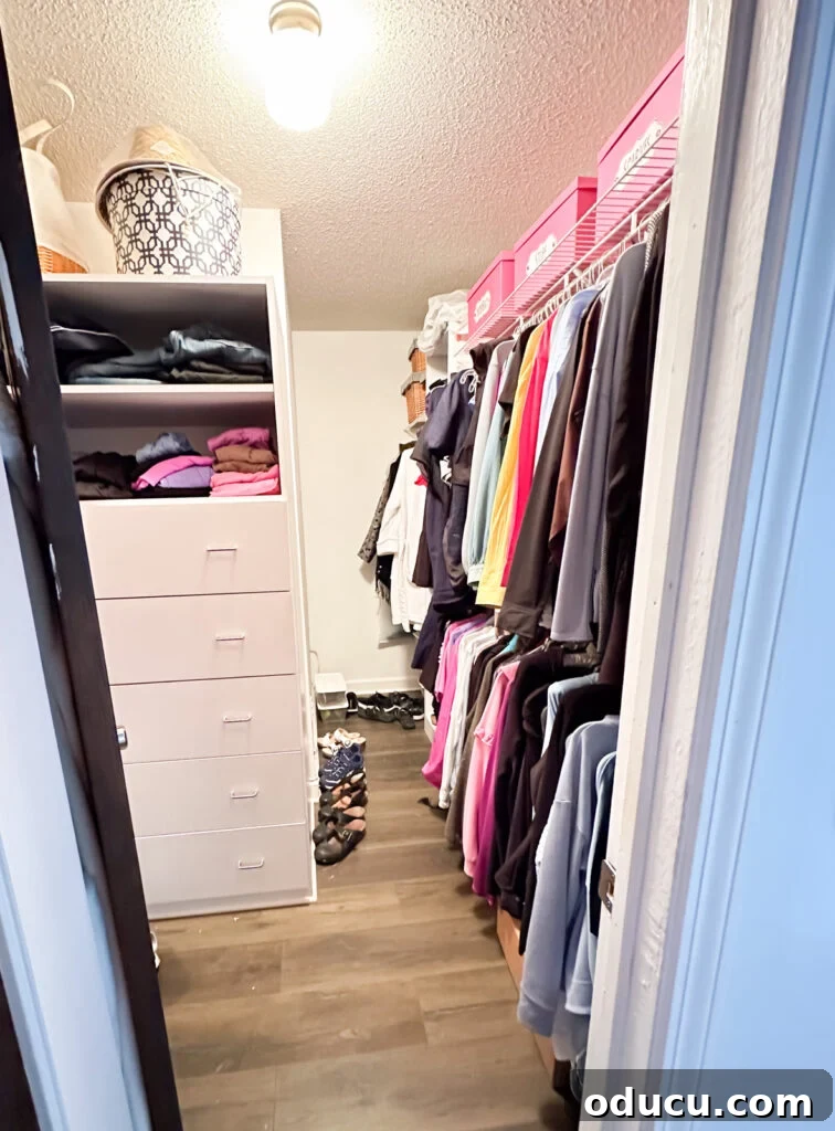Budget Closet Hacks 2 Clothes closet before getting cleaned out and reorganized, showing disarray