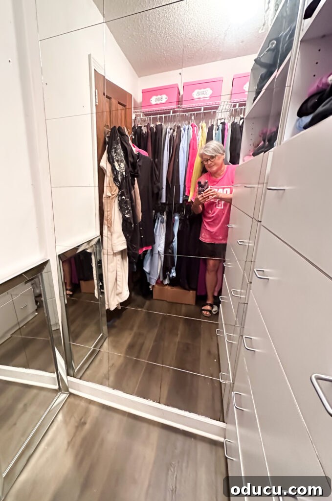 Budget Closet Hacks 3 Walk in clothes closet with wire shelving, tile mirrors and built-in drawers after organization