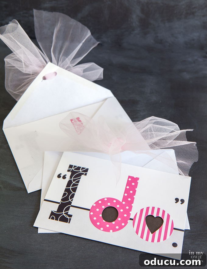 The Art of Hand Lettering: Designing Personalized Cards and Envelopes 11 Wedding card gift giving ideas, highlighting a beautifully hand-lettered envelope adorned with a tulle bow for a personal touch.