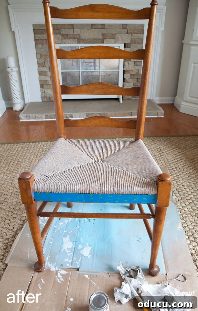 Transformed dining room chair with a newly stained driftwood rush seat, showcasing the complete makeover.