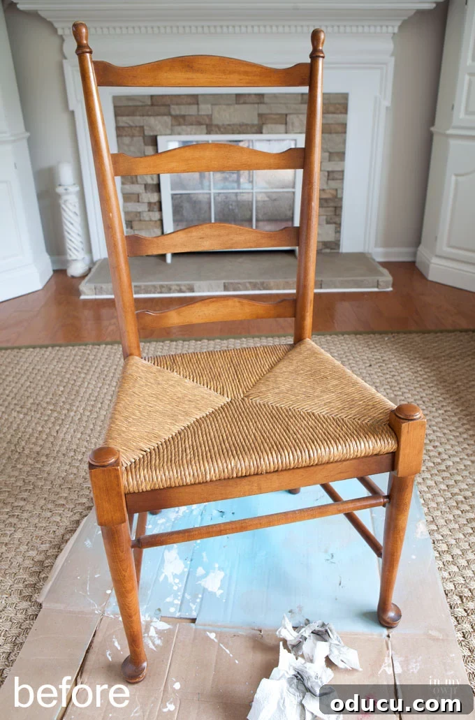 Dining room chair rush seat before staining, showing its original orange-brown tone.