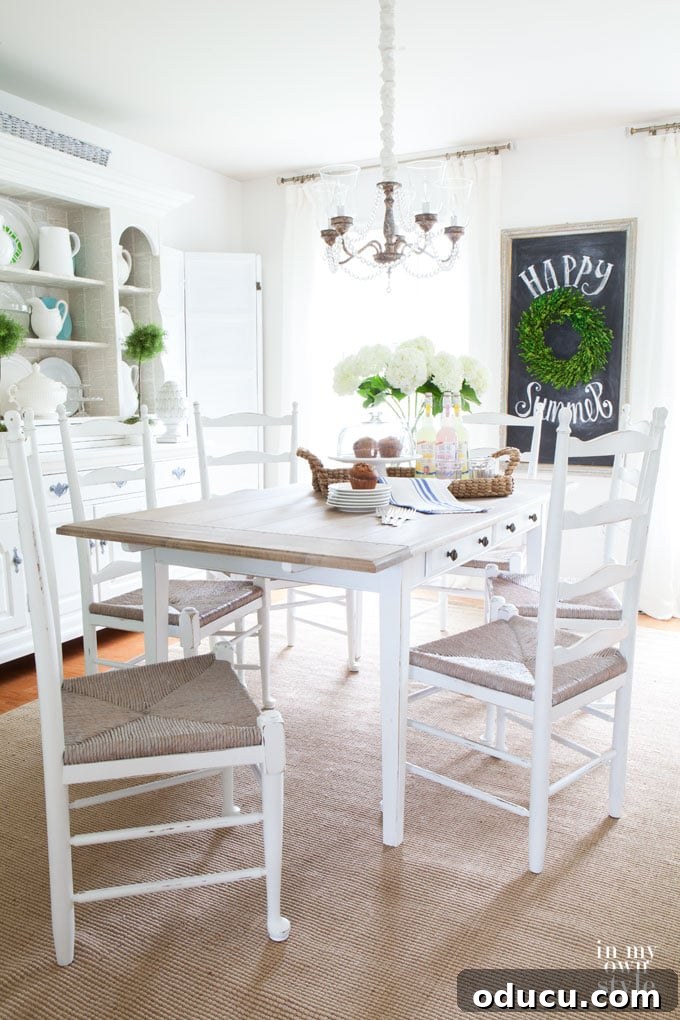 Breathing New Life Into Dining Chairs 13 Elegant dining room decorated predominantly with white, showcasing the light and airy aesthetic.