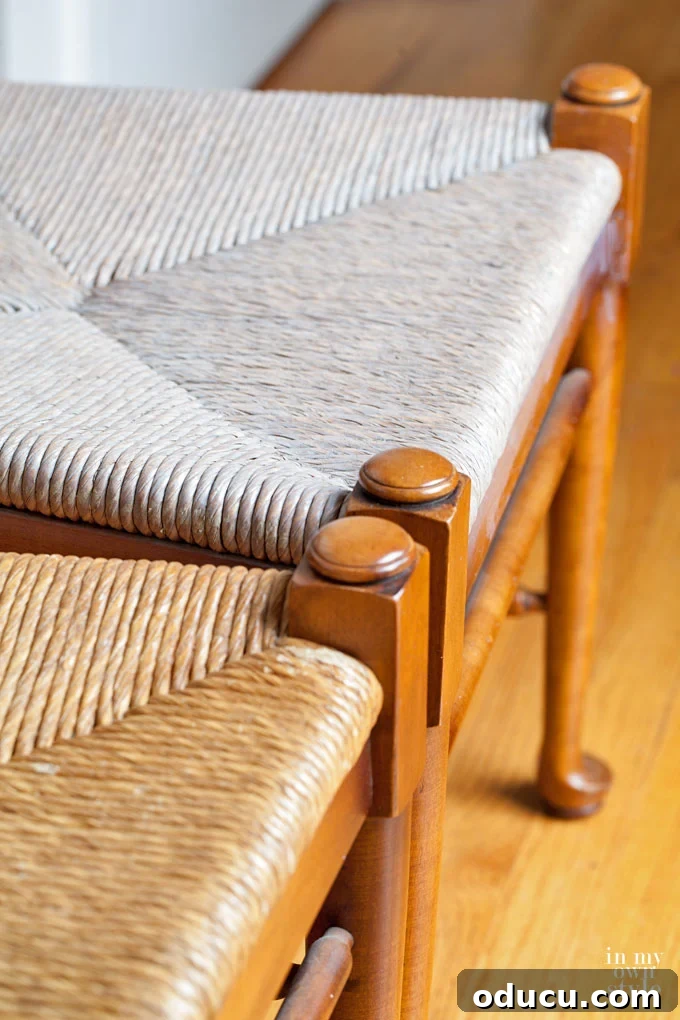 Breathing New Life Into Dining Chairs 2 Close-up of dining chair rush seats stained with a driftwood finish.