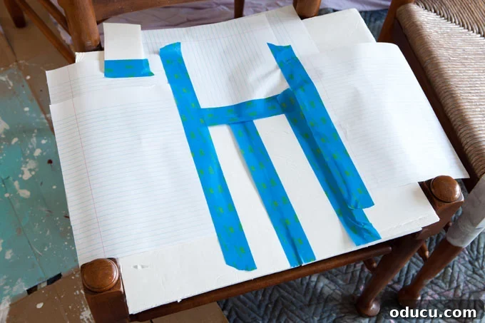 Breathing New Life Into Dining Chairs 7 Furniture painting tips on how to mask areas you don't want painted on dining chairs, specifically rush seats.