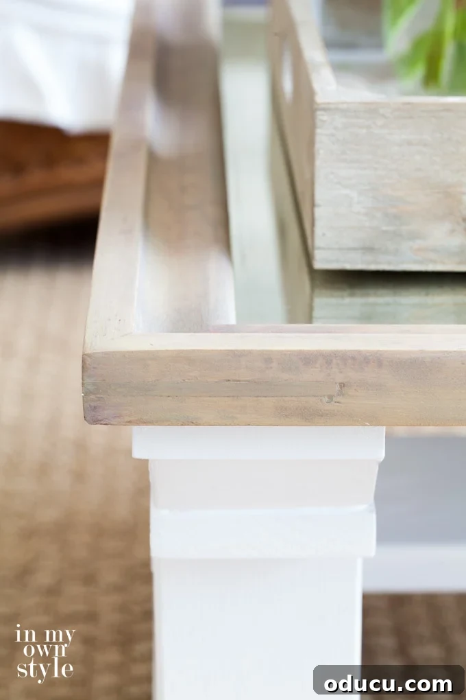 Reborn Reflection Coffee Table 11 The final driftwood stain finish on the table top's mirror frame, showing the successful color correction and weathered look.