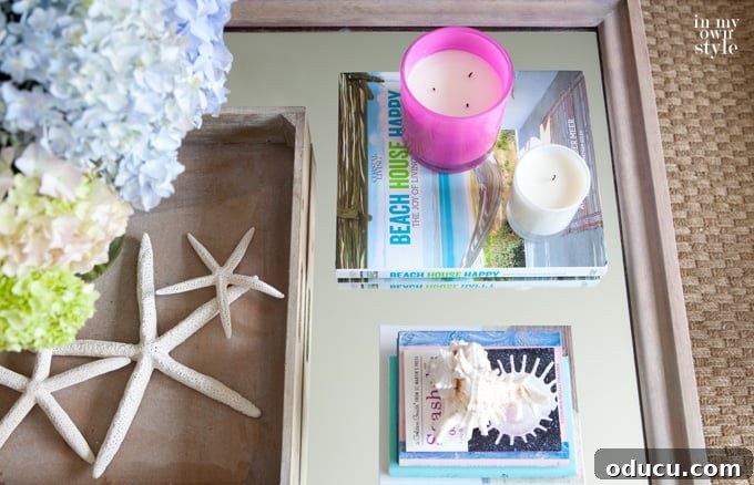 Reborn Reflection Coffee Table 13 Various styling accessories displayed on the new coffee table, adding personal touches to the living room decor.