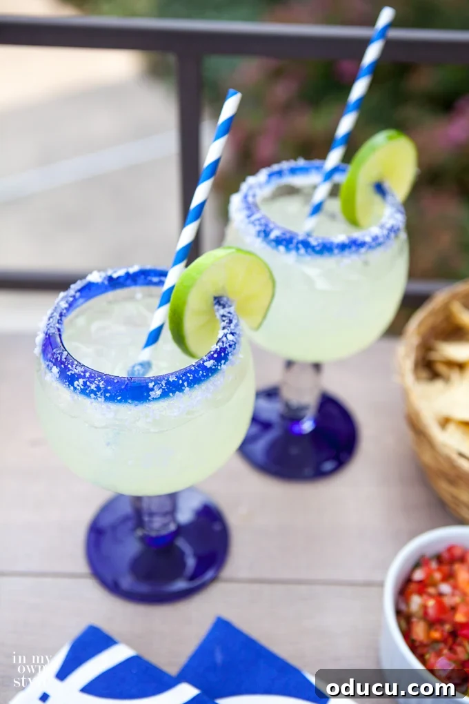 Crafting the Perfect Margarita 3 Close-up of a refreshing pitcher of Ed's best margarita recipe, perfect for a summer gathering.