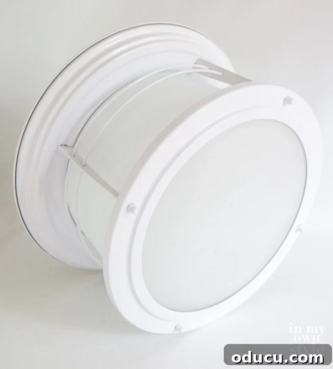 Paint Your Ceiling Light Fixture for a Brand New Look 3 Newly painted glossy white nautical ceiling light fixture