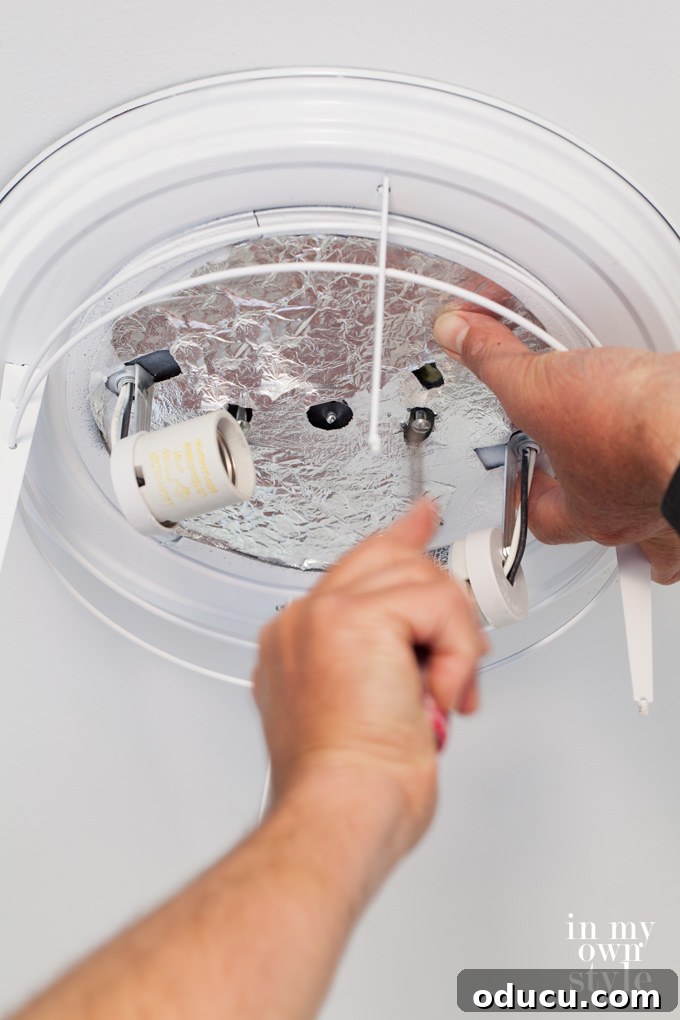Paint Your Ceiling Light Fixture for a Brand New Look 6 Mounting the ceiling light fixture to the electrical box