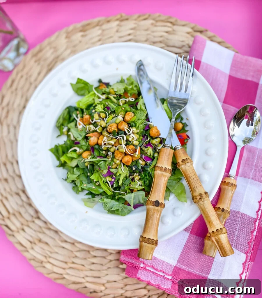 Outdoor Dining Done Right 4 white dinner plate with salad on a pink tray for outdoor dining
