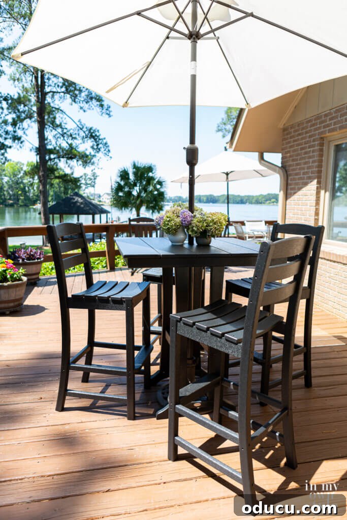 Outdoor Dining Done Right 7 Polywood high top table with an umbrella on a sunny deck