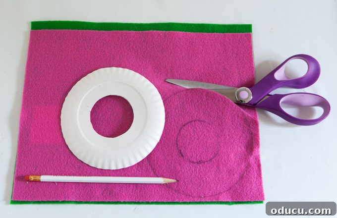 Christmas Door Knob Jingle 3 Tracing and cutting felt circles for a handmade Christmas jingle bell wreath.