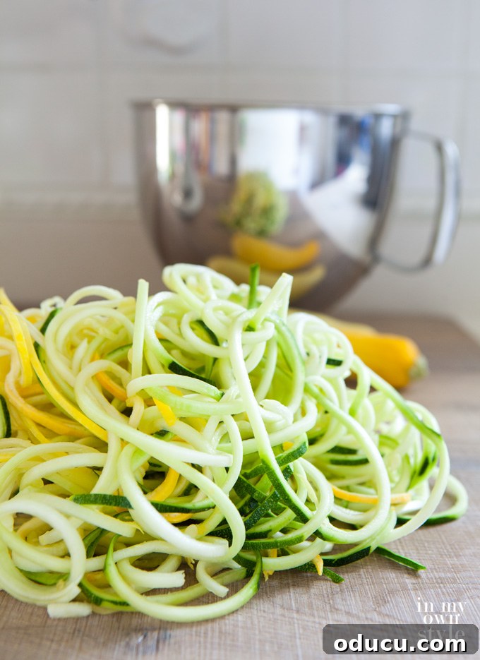 Freshly spiralized zucchini and yellow squash ready for cooking