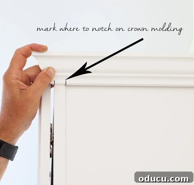 Mudroom Makeover: DIY Wall Cabinet Installation 4 Diagram illustrating how to attach crown molding to cabinets that don't reach the ceiling, showing wood blocks and notched molding.