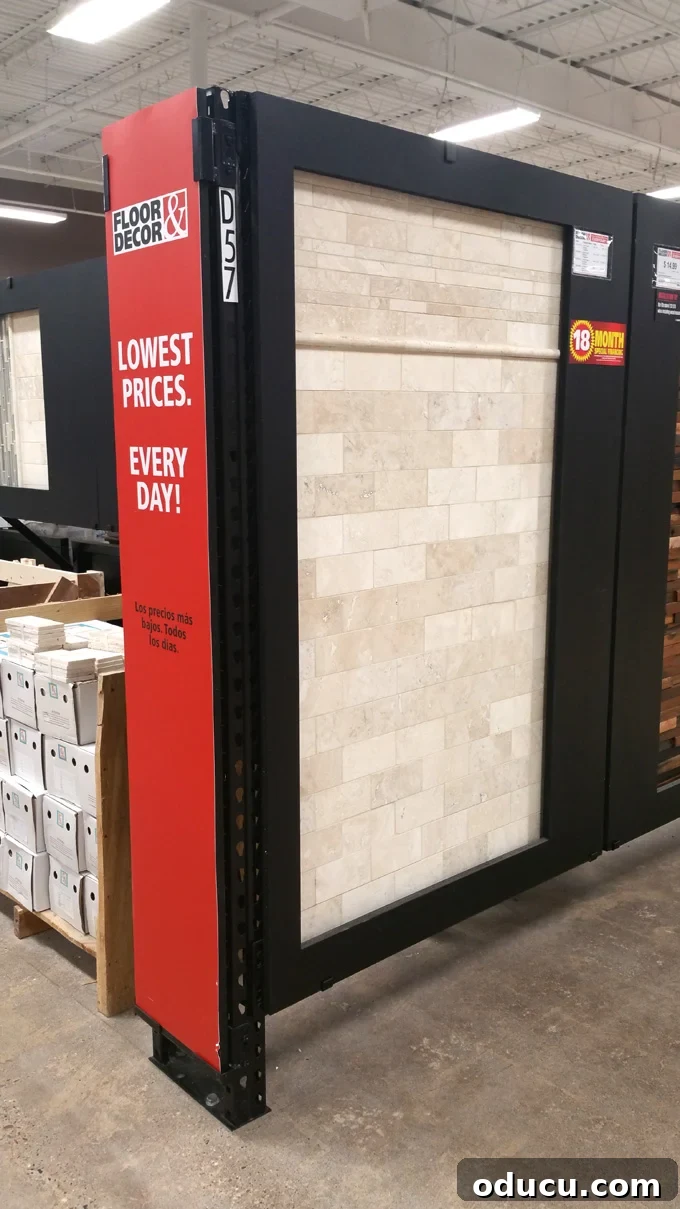 Luxury Master Shower Transformation 4 Tile display wall at a Floor and Decor Store, showcasing various stone and ceramic tile options for home renovation.