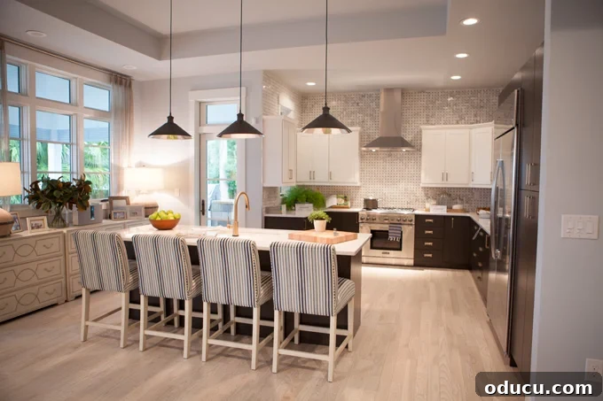 Step Inside the HGTV Dream Home 2016 10 The stunning kitchen of the HGTV Dream Home 2016, featuring a modern design with white and black elements and high-end appliances.