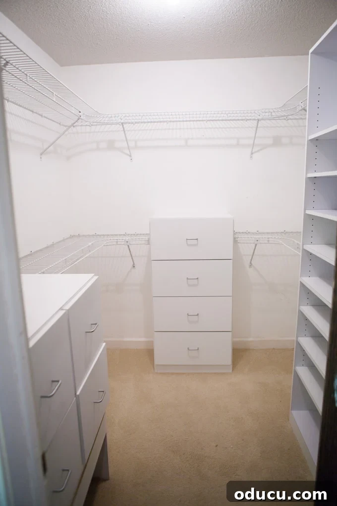 A Glimpse Inside My Brand New Home 11 His walk-in closet in the master bedroom with shelves and hanging rods.