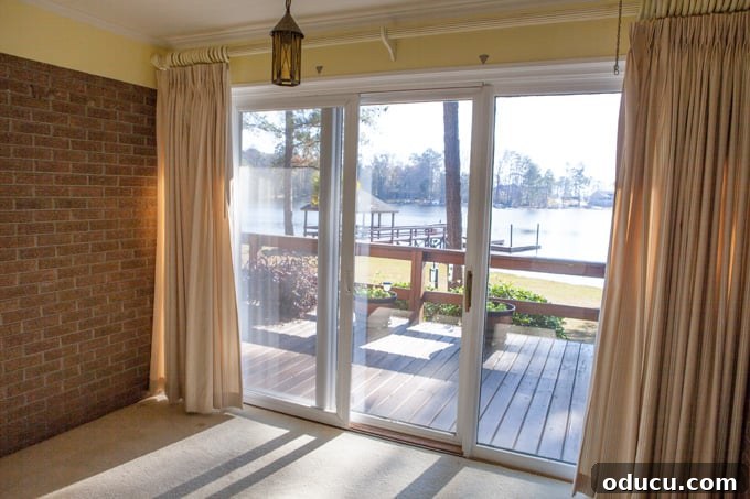 A Glimpse Inside My Brand New Home 16 Master bedroom with dark draperies covering windows, overlooking the lake.