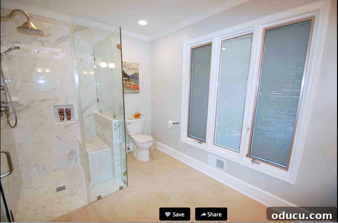 A Glimpse Inside My Brand New Home 17 Glass-enclosed marble shower in a renovated master bathroom.