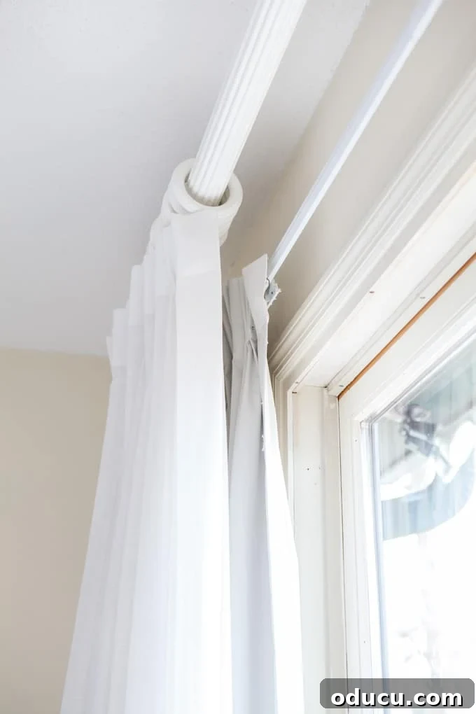 The Pursuit of Pristine White Drapes 8 Guide on how to hang room darkening drapes and curtains for privacy and light control