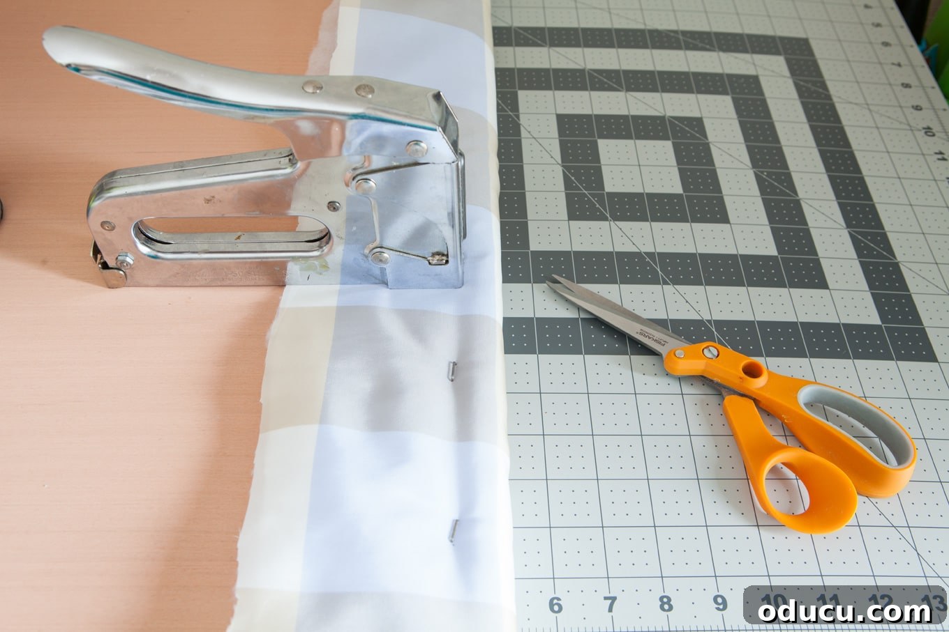 Upcycled Cushioned Headboard 10 How to use a staple gun to attach fabric for a DIY headboard