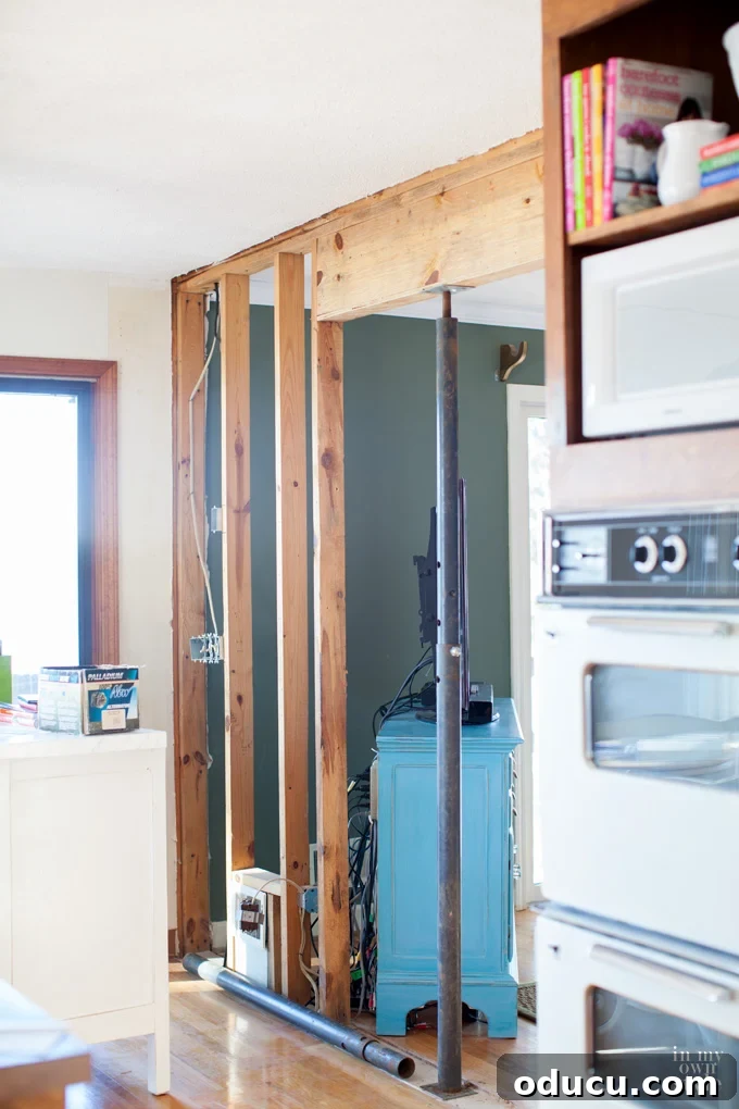 The Illusion of Effortless TV Renovations 3 Fixer upper lake house knocking down a wall between kitchen and living room