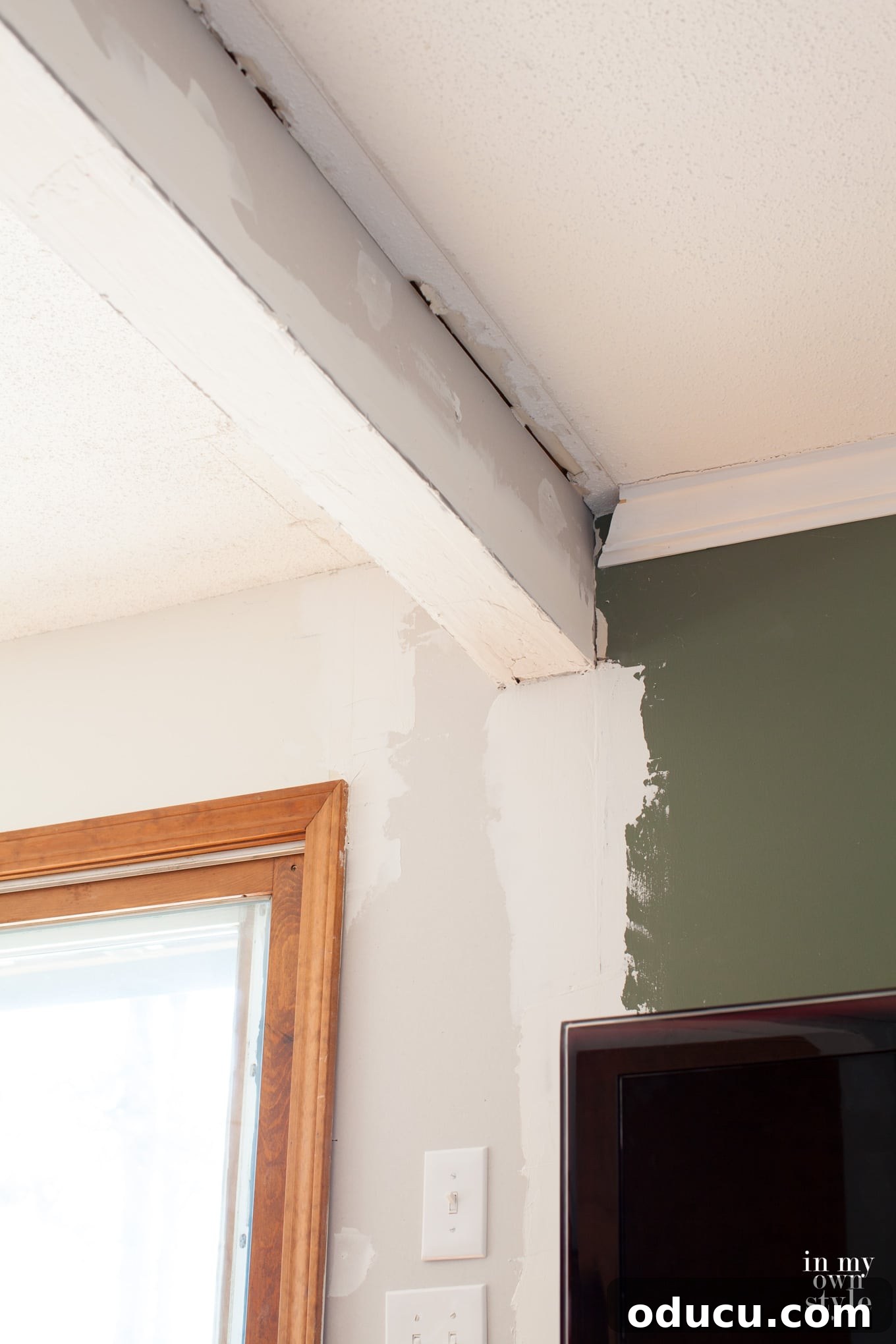 The Illusion of Effortless TV Renovations 5 Adding a ceiling beam when removing a wall between two rooms for structural support