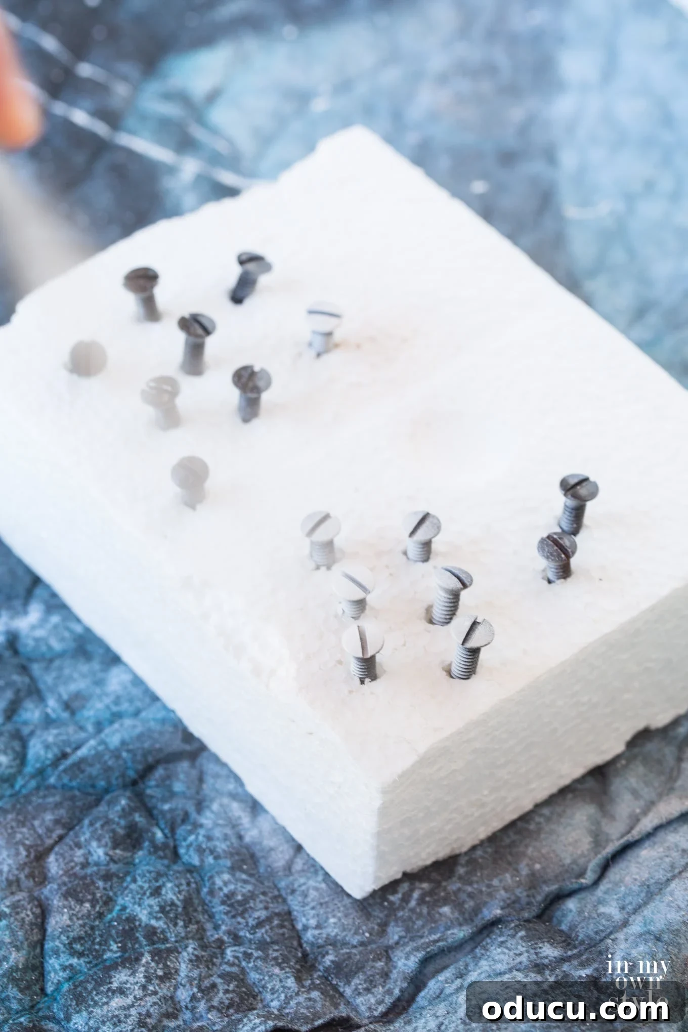 How-to-paint-nails-and-screws-the-easy-way Clever method for spray painting screws using a foam block to hold them