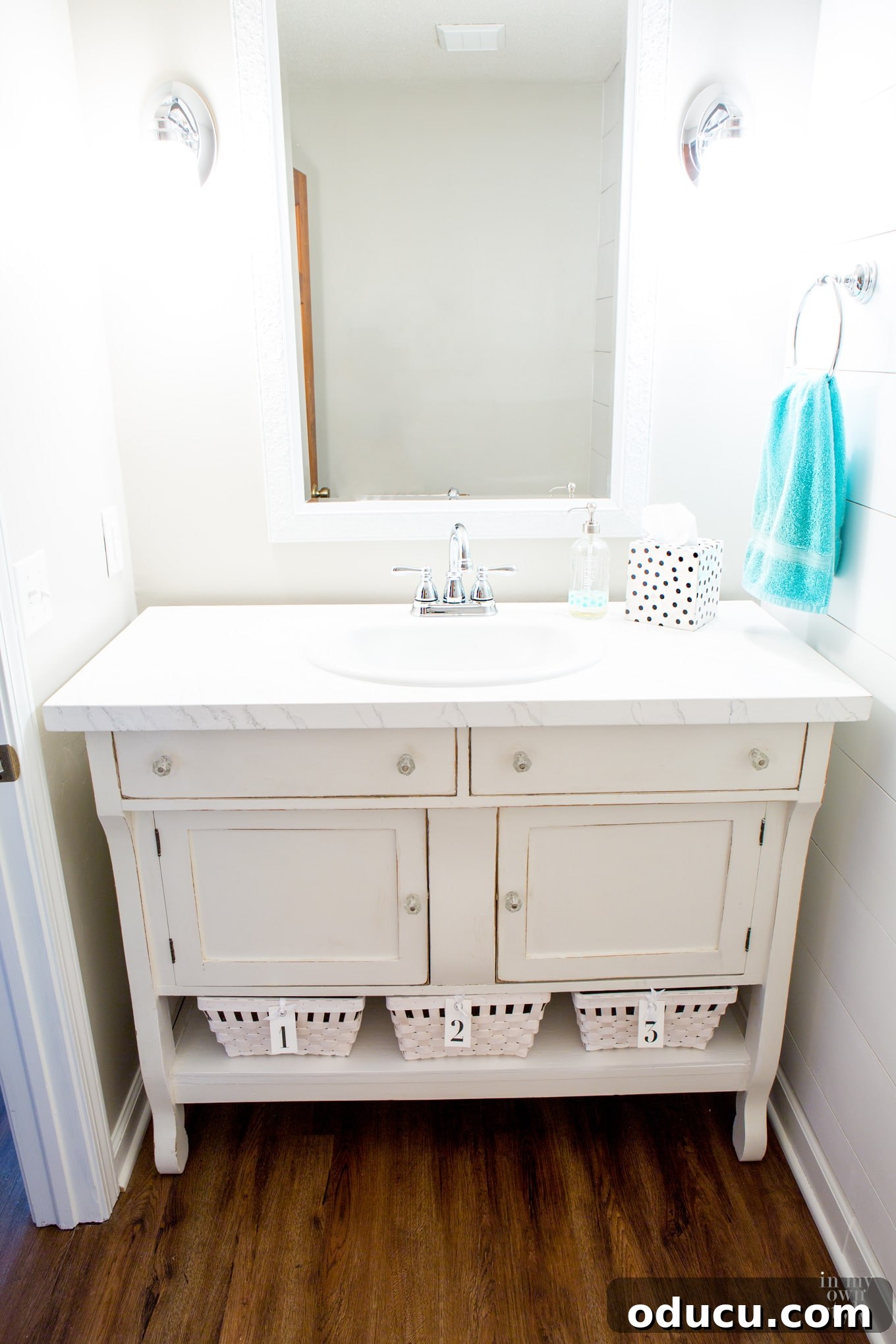 A repurposed vintage sideboard transformed into a stylish bathroom vanity.