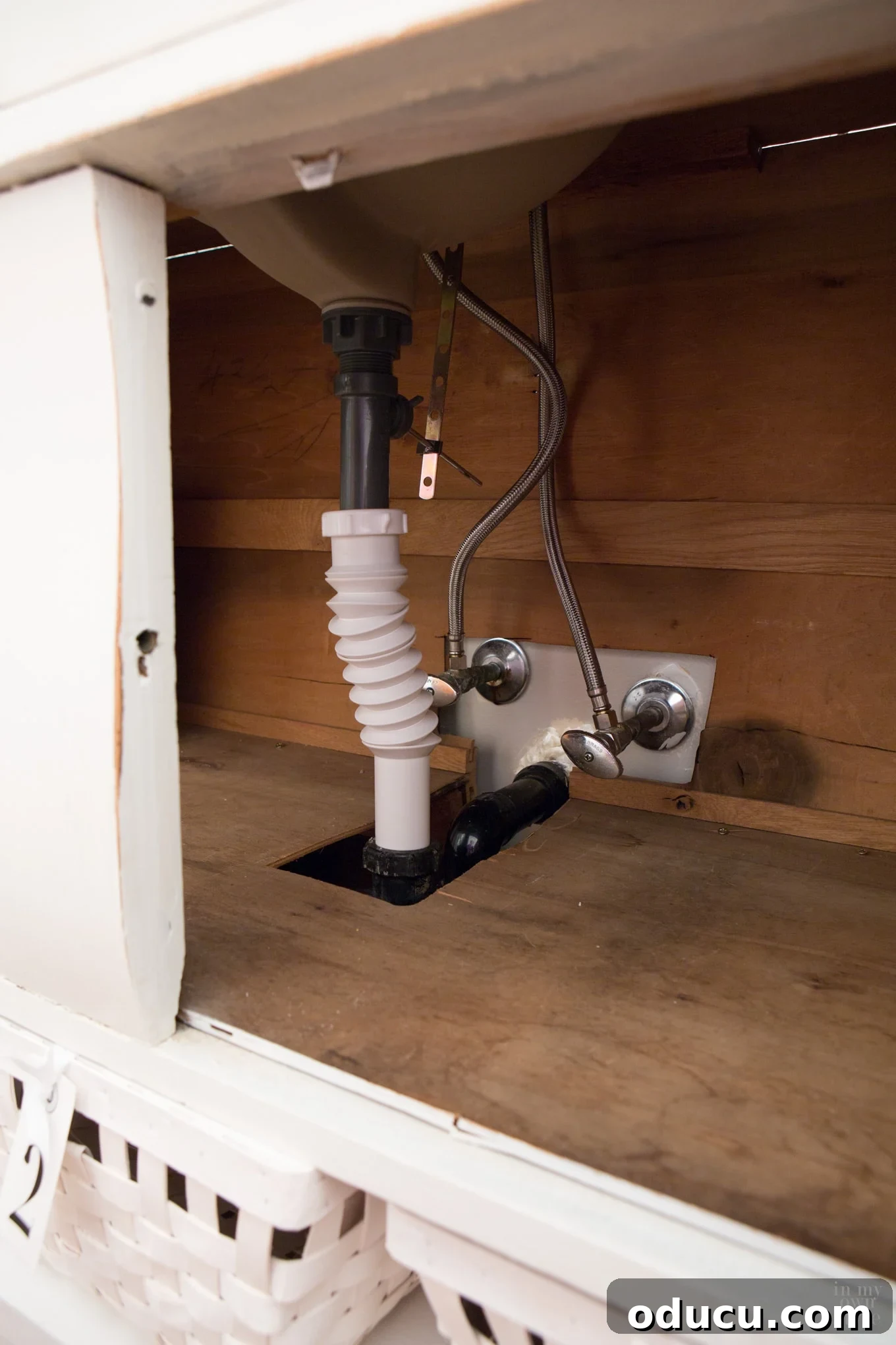 Transforming a Sideboard into a Bathroom Vanity 13 Attaching new plumbing fittings to the sink and wall connections