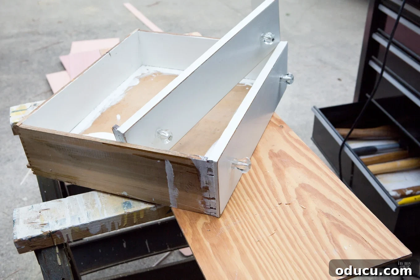 Transforming a Sideboard into a Bathroom Vanity 15 Cutting the fronts off old drawers to create faux drawer panels