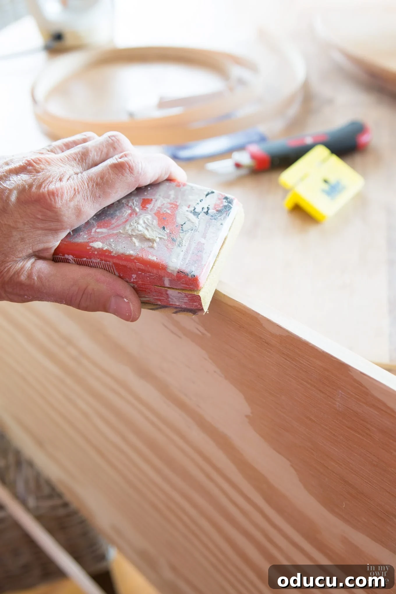 Transforming a Sideboard into a Bathroom Vanity 19 Applying Band-It wood veneer to the edge of plywood